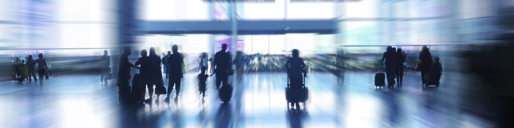 blurred image of people at airport